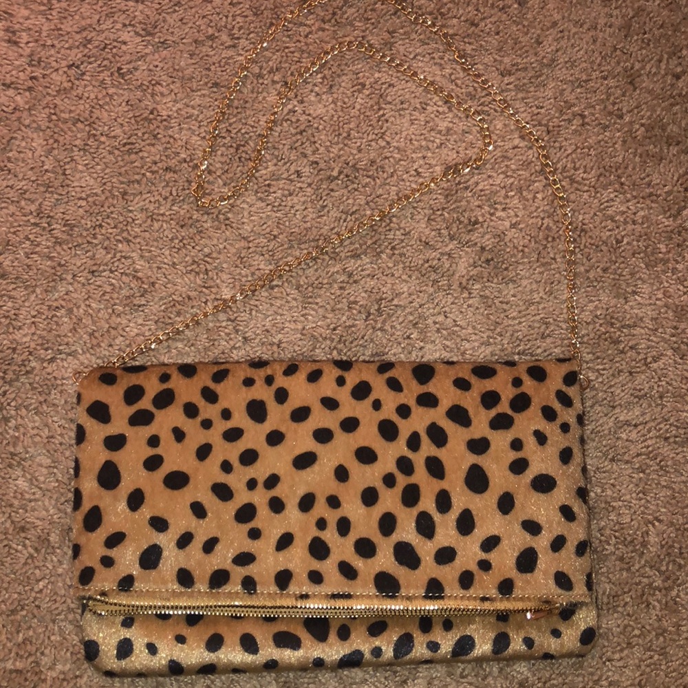 By fold leopard satchel